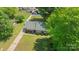 Aerial view of a single-story home featuring a long driveway and green lawn at 8206 Idlewild Rd # 22, Indian Trail, NC 28079
