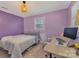 Comfortable bedroom with a desk area, natural light, and soft decor touches for a relaxing atmosphere at 8206 Idlewild Rd # 22, Indian Trail, NC 28079
