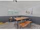 Dining room showcasing wainscoting, wood floors, lots of light and modern decor at 8206 Idlewild Rd # 22, Indian Trail, NC 28079