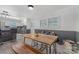 Dining room with natural light, unique dining table and decorative wainscoting at 8206 Idlewild Rd # 22, Indian Trail, NC 28079