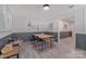 Bright dining room with wainscoting, wood floors, natural lighting, and modern decor at 8206 Idlewild Rd # 22, Indian Trail, NC 28079