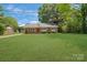 Charming single-story home featuring a well-maintained lawn and beautiful landscaping at 8206 Idlewild Rd # 22, Indian Trail, NC 28079