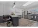 Open-concept kitchen featuring stainless appliances, granite counters, and an eat-in island at 8206 Idlewild Rd # 22, Indian Trail, NC 28079