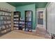 Cozy storage room featuring full bookshelves, movie collection, and doorway, all with warm neutral accents at 8206 Idlewild Rd # 22, Indian Trail, NC 28079