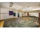 Expansive basement with open layout, brick fireplace, and concrete flooring at 830 Cabaniss Dr, Shelby, NC 28150