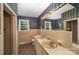 Blue floral bathroom with double sinks, tile accents, and a window providing natural light at 830 Cabaniss Dr, Shelby, NC 28150