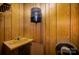 Small bathroom showcasing a retro-style yellow sink and wood-paneled walls at 830 Cabaniss Dr, Shelby, NC 28150