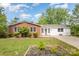 Charming single-story home featuring a brick facade, white siding, and a well-manicured front yard at 830 Cabaniss Dr, Shelby, NC 28150