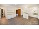 The kitchen flows seamlessly into the living area featuring light countertops, an island, and hardwood floors at 830 Cabaniss Dr, Shelby, NC 28150