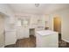 Bright kitchen featuring crisp white cabinets, countertops, updated appliances, and hardwood floors at 830 Cabaniss Dr, Shelby, NC 28150