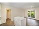 A kitchen island provides additional countertop space and a transition to the living room and deck access at 830 Cabaniss Dr, Shelby, NC 28150