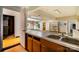 Basement kitchen area featuring a double sink and wood cabinets at 830 Cabaniss Dr, Shelby, NC 28150