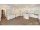 The kitchen flows seamlessly into the living area featuring light countertops, an island, and hardwood floors at 830 Cabaniss Dr, Shelby, NC 28150