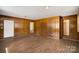 Spacious living room featuring wood paneling and durable laminate flooring at 830 Cabaniss Dr, Shelby, NC 28150