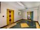 Room with unique decorated door, colorful trim, and painted floors, needing some TLC to restore at 830 Cabaniss Dr, Shelby, NC 28150