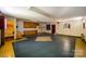 Room with built-in cabinets, painted floors, and access to another room, awaiting a modern refresh at 830 Cabaniss Dr, Shelby, NC 28150