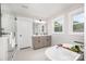 Relaxing bathroom featuring a soaking tub, double vanity, and a glass shower at 9527 Walkers Ferry Rd, Charlotte, NC 28214