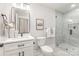 Modern bathroom featuring a glass-enclosed shower with marble-style tile and a white vanity at 9527 Walkers Ferry Rd, Charlotte, NC 28214