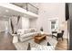 Spacious living room featuring hardwood floors, neutral tones, and an open staircase to the second floor at 9527 Walkers Ferry Rd, Charlotte, NC 28214