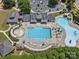 Overhead perspective of community pool, including a splash pad and many seating options at 1007 Wessington Manor Ln, Fort Mill, SC 29715