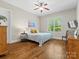 Cozy bedroom with hardwood floors, natural light, and comfortable furnishings at 1007 Wessington Manor Ln, Fort Mill, SC 29715