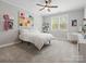 Light-filled bedroom with carpet floors, ceiling fan and window with plantation shutters at 1007 Wessington Manor Ln, Fort Mill, SC 29715