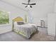 Bright and airy bedroom features a large bed, soft carpet, and neutral color palette at 1007 Wessington Manor Ln, Fort Mill, SC 29715