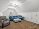 Spacious bonus room with vaulted ceilings, neutral carpet, and ample seating at 1007 Wessington Manor Ln, Fort Mill, SC 29715