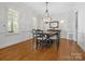 Formal dining room with hardwood floors, a chandelier, and bright natural light at 1007 Wessington Manor Ln, Fort Mill, SC 29715
