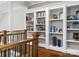 Bright hallway nook features a white bookcase with open shelving for display and storage at 1007 Wessington Manor Ln, Fort Mill, SC 29715