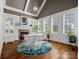 Bright home office with vaulted ceiling, fireplace, and large windows with plantation shutters at 1007 Wessington Manor Ln, Fort Mill, SC 29715