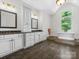 Spacious main bathroom with double vanity, soaking tub, and ample counter space at 1007 Wessington Manor Ln, Fort Mill, SC 29715