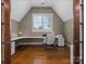 Bright office with large desk, hardwood floors and ample natural light through the window at 1007 Wessington Manor Ln, Fort Mill, SC 29715