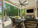 Inviting covered patio with outdoor furniture, ceiling fan, and TV, perfect for entertaining at 1007 Wessington Manor Ln, Fort Mill, SC 29715