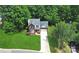 Stunning aerial view of a two-story brick home with lush green lawn and mature trees at 101 Creekside Dr, Fort Mill, SC 29715
