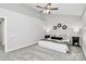 Neutral bedroom with vaulted ceilings, plush carpet, and decorative mirror accents at 101 Creekside Dr, Fort Mill, SC 29715