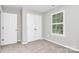 Bedroom featuring neutral walls, carpet, a window with blinds, and a closet at 101 Creekside Dr, Fort Mill, SC 29715