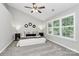 Neutral bedroom with vaulted ceilings, plush carpet, and large windows with shutter blinds at 101 Creekside Dr, Fort Mill, SC 29715