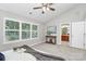 A neutral bedroom with vaulted ceilings, carpeted floor, and view to an ensuite bath at 101 Creekside Dr, Fort Mill, SC 29715