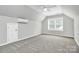 Spacious bedroom with high ceilings, neutral walls, carpet, and a ceiling fan at 101 Creekside Dr, Fort Mill, SC 29715