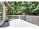Back deck overlooking a lush backyard with lots of trees and greenery at 101 Creekside Dr, Fort Mill, SC 29715