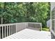Enjoy a wooden deck overlooking a lush backyard with mature trees and greenery at 101 Creekside Dr, Fort Mill, SC 29715