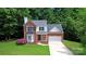 Beautiful two-story brick home with a well-manicured lawn and mature trees at 101 Creekside Dr, Fort Mill, SC 29715