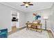 A home office boasts neutral decor, a wood desk, and a light-filled view to the kitchen at 101 Creekside Dr, Fort Mill, SC 29715