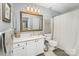 Bright bathroom featuring a framed mirror, vanity with sink, and shower with curtain at 104 Pier 33 Dr # 311, Mooresville, NC 28117