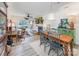 Cozy dining room with a wooden table and chairs, flowing into the living room with a fireplace and outdoor balcony access at 104 Pier 33 Dr # 311, Mooresville, NC 28117