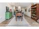 View of the dining room featuring a wooden table, decor accents, and a view into the kitchen with stainless steel appliances at 104 Pier 33 Dr # 311, Mooresville, NC 28117