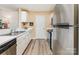 Modern kitchen with stainless steel appliances and ample counter space at 104 Pier 33 Dr # 311, Mooresville, NC 28117