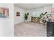 Bright living room with neutral carpet and natural light from window at 104 Pier 33 Dr # 311, Mooresville, NC 28117