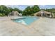 Outdoor swimming pool with lounge chairs, tables, and a shaded patio area perfect for relaxation and recreation at 104 Pier 33 Dr # 311, Mooresville, NC 28117